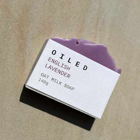 Bar of lavender soap with a label on a beige background